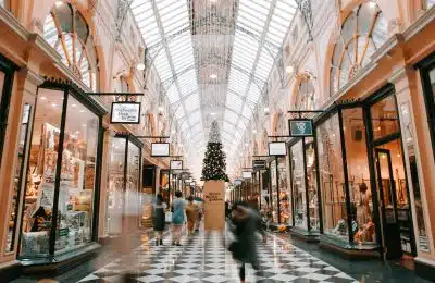 person walking inside building near glass